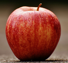 A low resolution image of a red, ripe apple